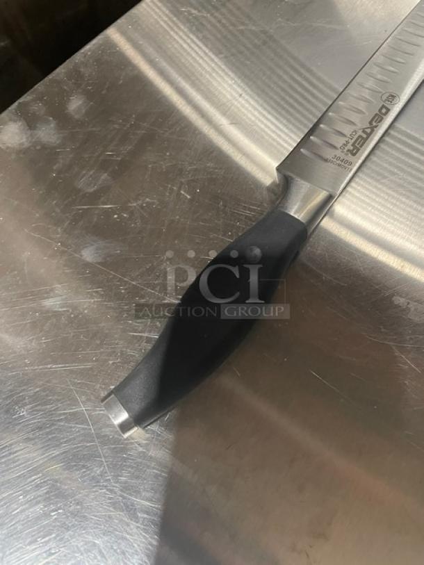 Brand new Dexter Russell I-Cut Pro Series 12" Duo-Edge Slicing Knife, Model 30409, with black grip handle, stainless steel blade.