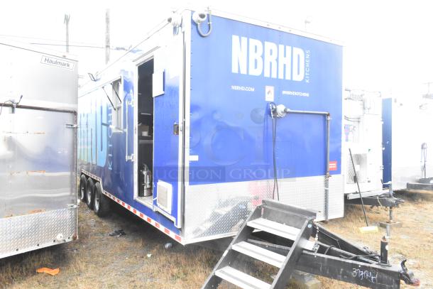 Cruising Kitchens 24' Burger King food trailer, blue with "NBRHD" branding, equipped with commercial kitchen appliances.