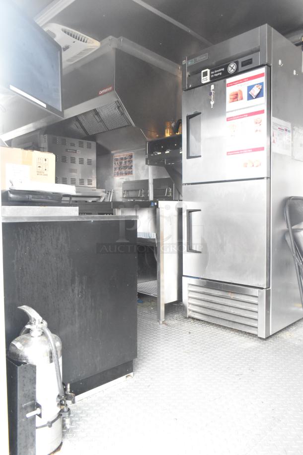 24' Burger King fast food trailer with commercial-grade kitchen, CaptiveAire hood, Nieco grill, True freezers, fire suppression.