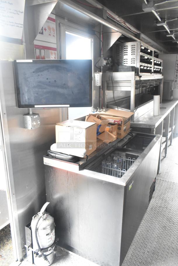 Cruising Kitchens 24' Burger King fast food trailer interior with commercial equipment, including a CaptiveAire grease hood.