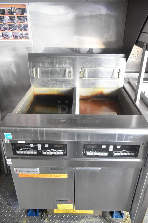 Frymaster 2-bay gas fryer in mobile kitchen. Stainless steel, digital controls, ideal for fast food operations.