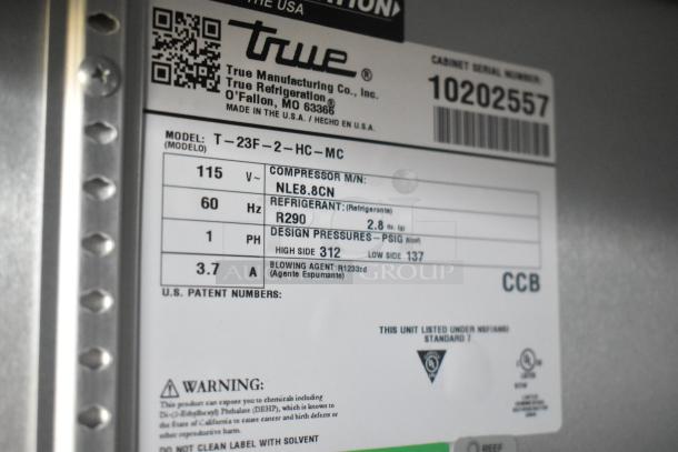 Label inside a True refrigerator model T-23F-2-HC-MC, detailing specifications like voltage, refrigerant type, and pressures.