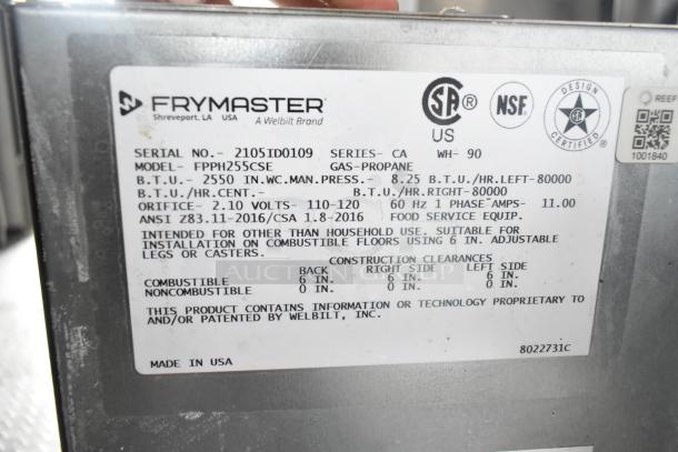 Label on Frymaster model FPPH255CSE shows specifications, BTU ratings, voltage, and safety certifications for a gas-propane fryer.