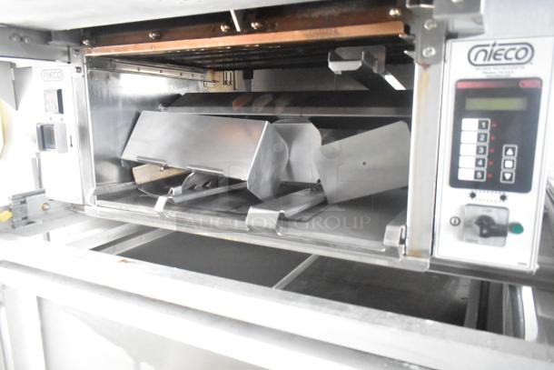Nieco Charbroiler Grill inside a fully outfitted 24' Burger King mobile kitchen trailer, featuring control panel and stainless interior.