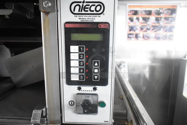 Nieco charbroiler control panel in Cruise Kitchens trailer; features keypad and on/off switch, Windsor, CA, USA.