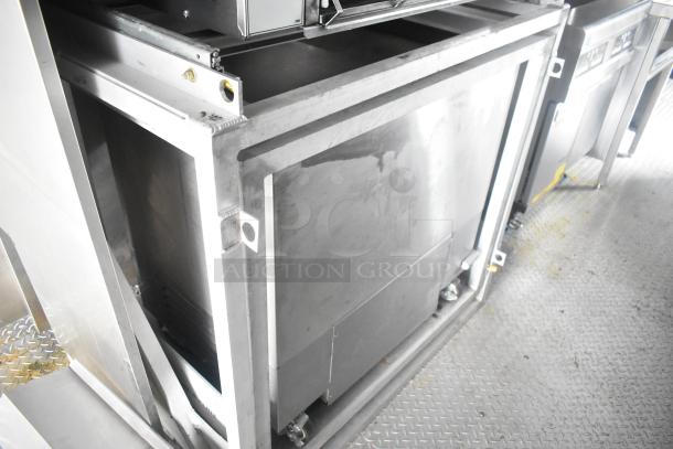 Cruising Kitchens 24' Burger King mobile kitchen trailer, stainless steel interior with commercial equipment setup.