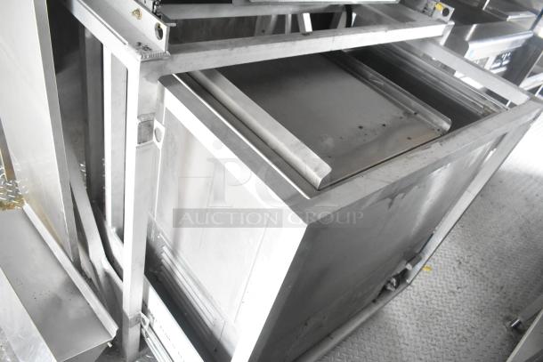 Interior view of Cruising Kitchens 24' Burger King trailer, highlighting stainless steel commercial kitchen equipment and fixtures.