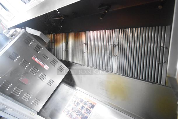 Interior of a Cruising Kitchens 24' mobile kitchen trailer showing BroilVection oven and stainless steel fixtures.