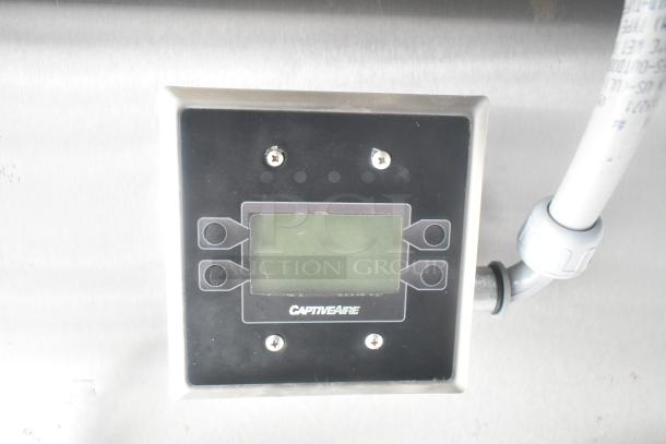 CaptiveAire control panel on a stainless steel surface, part of a commercial-grade mobile kitchen setup.