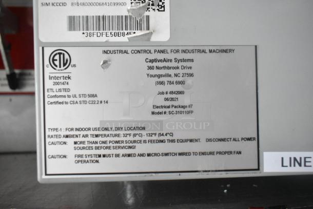 CaptiveAire Systems control panel with safety and usage labels, including ETL and model details for a mobile kitchen setup.