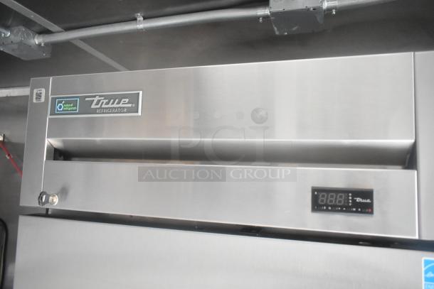 True Reach-In Cooler detail inside a 24' Cruising Kitchens mobile kitchen trailer. Features digital display and robust design.