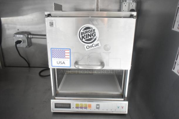 Burger King OnCue commercial warmer in stainless steel, marked "Fabricated and Assembled in the USA," with control panel.