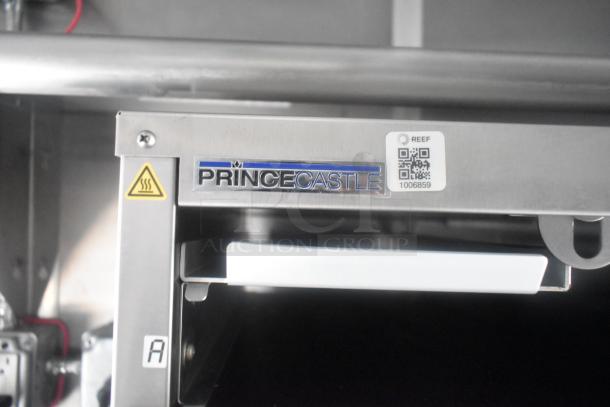 Prince Castle equipment with a QR code label and caution symbol, part of a Cruising Kitchens mobile kitchen trailer.