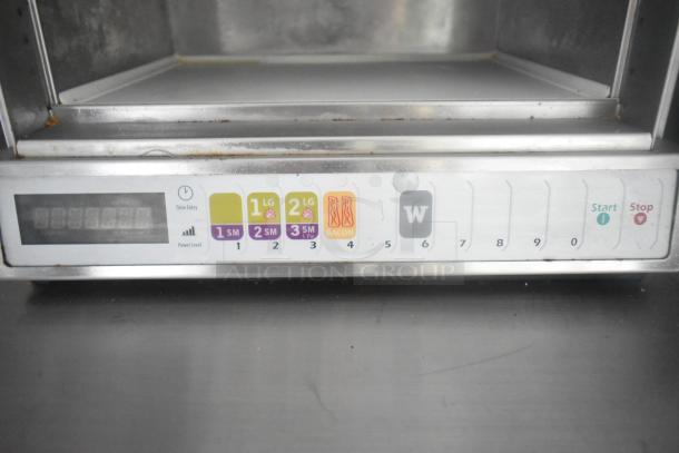 Control panel of commercial kitchen equipment featuring labeled buttons for size and food type selections with start/stop options.