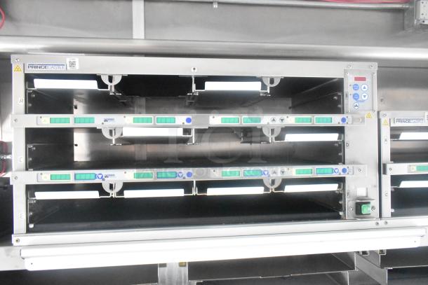 Prince Castle commercial kitchen equipment with multiple adjustable racks, control panel, and branding labels visible.