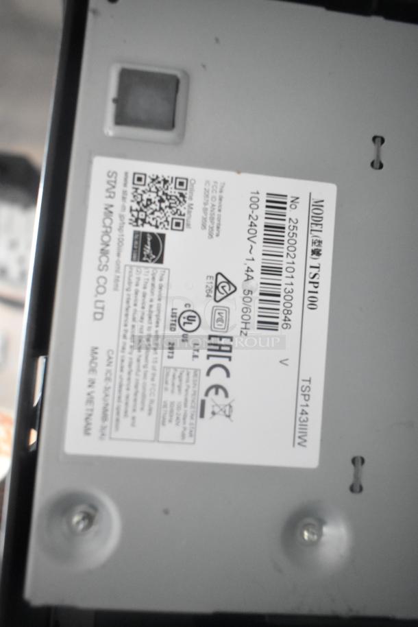 Close-up of a Star Micronics TSP143IIIW printer label, showing model number, voltage, and certification details.