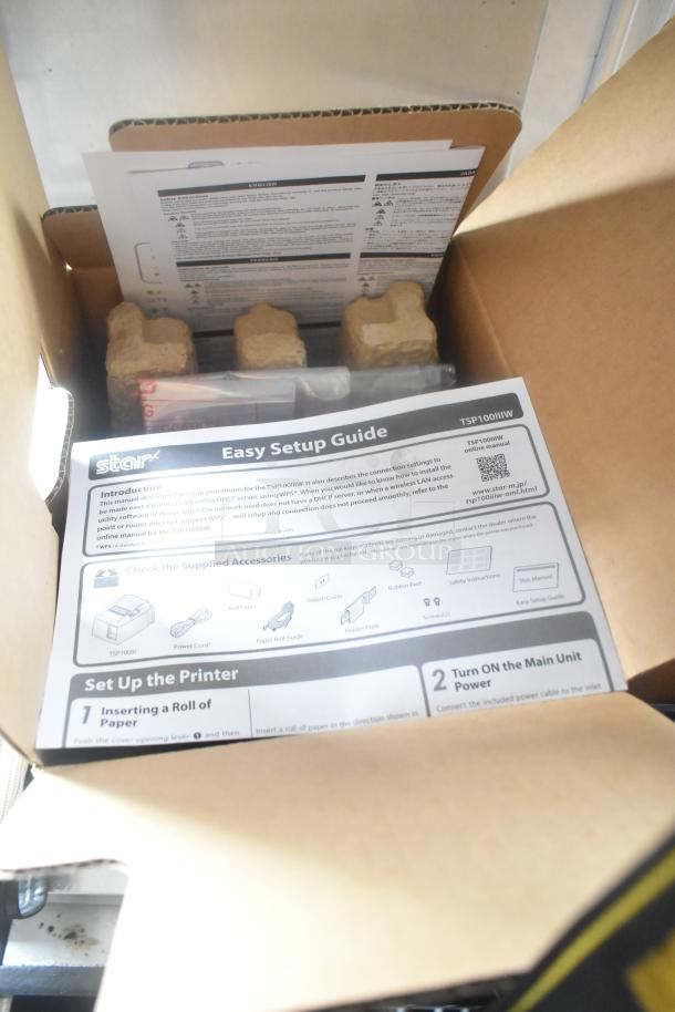 Box containing a Star TSP100IIW printer setup guide, showing accessories and instructions for setup.
