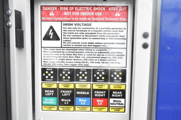 High voltage warning label on Cruising Kitchens 24' fast food trailer, instructions for generator connection, risk alert.