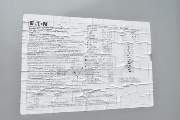 Crinkled Eaton label with electrical specifications for 400 amps max, installation instructions, and circuit breaker details.