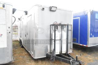 ATX 24' food trailer, 2021 model, silver with commercial kitchen setup, propane tanks, clear title, ideal for ghost kitchens.