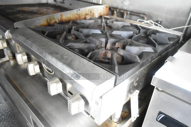 ATX mobile kitchen with a Royal gas range in stainless steel. Equipped with commercial-grade burners and dials.