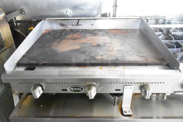 Royal gas flat top grill in used condition, part of ATX 24' food trailer. Features easy-to-use temperature knobs.