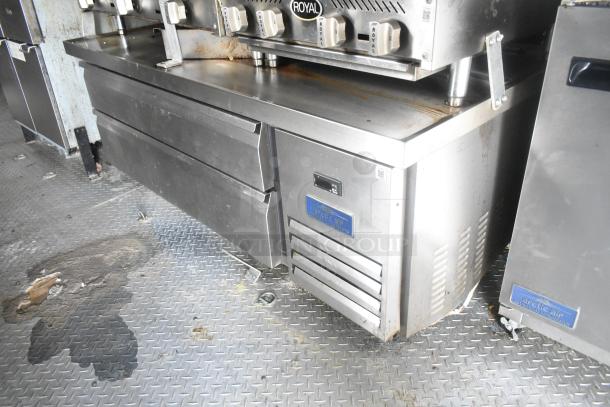 ATX 24' food trailer with Royal gas range, Arctic Air prep tables, and fryers. Features commercial equipment, ready for use.