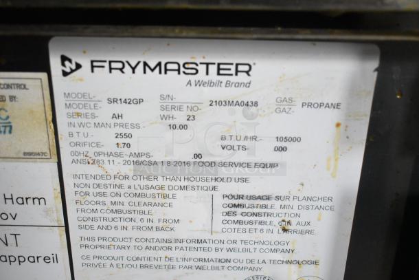 Frymaster label on commercial gas fryer indicating model SR142GP, propane type, and 105,000 BTU/hr output.