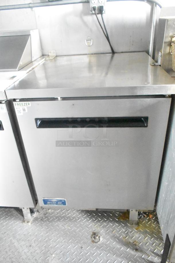 ATX 24' food trailer with Arctic Air prep table; stainless steel, commercial equipment, label visible, excellent condition.