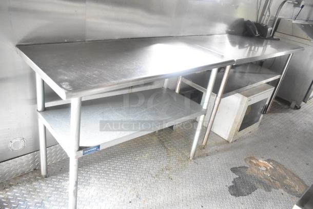 ATX 24' food trailer interior with stainless steel prep tables, visible Arctic Air branding, and diamond plate flooring.