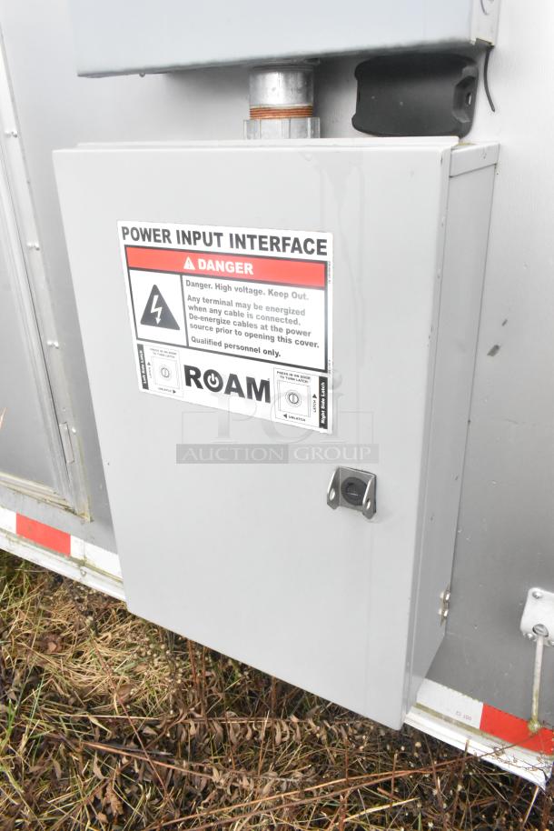 Power input interface on ATX 24' food trailer exterior, showing "Danger: High Voltage" warning label for safety.