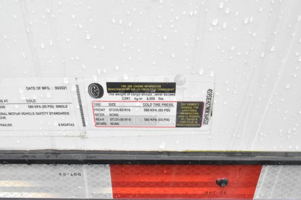 Label on Southern Dimensions 24' trailer, manufactured 06/2021. Tire size: ST235-80-R16, max cargo 2,041 kg.
