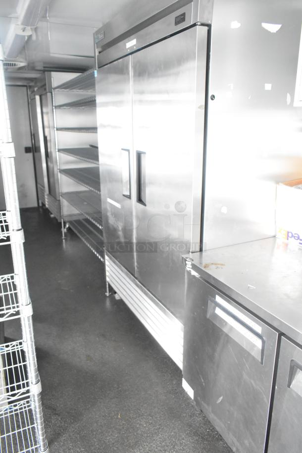 Southern Dimensions 24' cold food/beverage trailer with True coolers, freezers, sinks, and wire shelving. Mint condition.