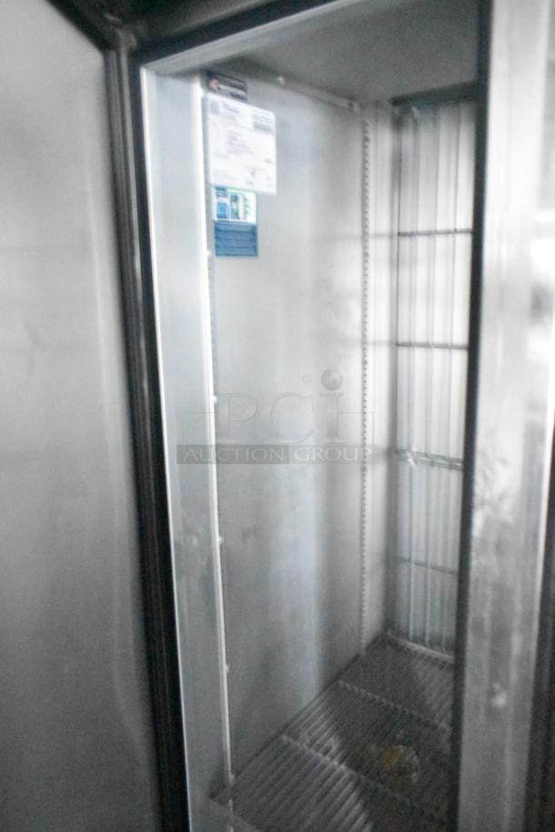 Interior of Southern Dimensions 24' trailer featuring True reach-in cooler with wire shelving; commercial-grade equipment visible.