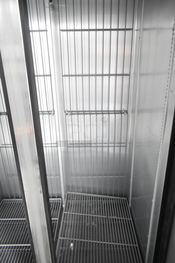 Southern Dimensions 24' trailer interior with wire shelving, ideal for cold food, beverage, or retail use. Clean and ready for setup.