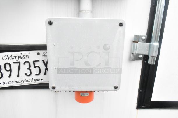 White metal utility box on exterior of a new 2021 Southern Dimensions trailer with Maryland license plate.