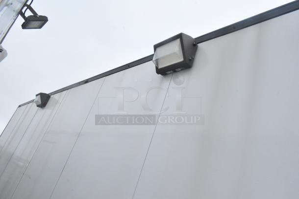 Exterior view of a Southern Dimensions 24' unbranded cold food and beverage trailer. Features mounted exterior lights.