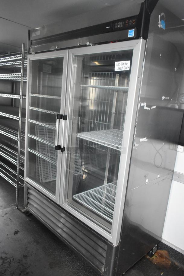 Southern Dimensions 24' retail trailer interior with Norlake 2-door coolers, wire shelving, and robust commercial equipment.