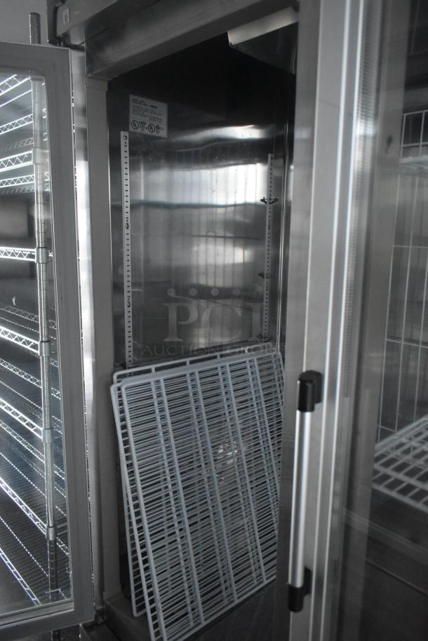 Interior view of Southern Dimensions 24' trailer showing Norlake cooler with wire shelving, ready for food storage.