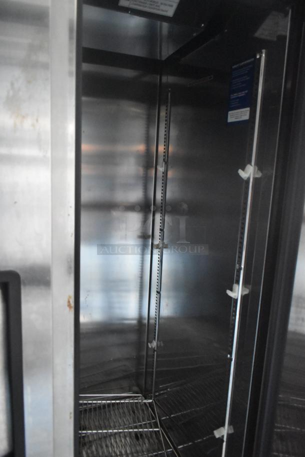 Interior view of a Norlake 2-door cooler in a 24' Southern Dimensions food trailer, featuring wire shelving and stainless steel finish.