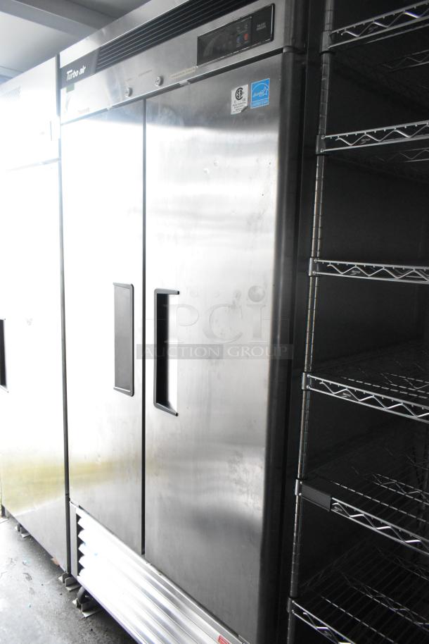 Southern Dimensions 24' trailer interior, featuring Turbo Air double-door freezer and wire shelving. Commercial-grade setup.