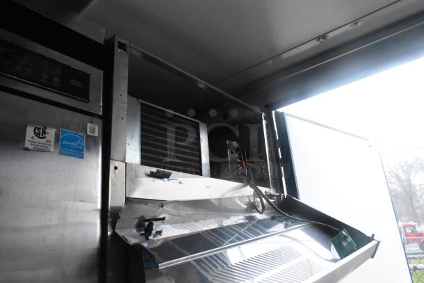 Interior view of a Southern Dimensions 24' cold food and beverage trailer, showing commercial coolers and freezers. Energy Star label visible.