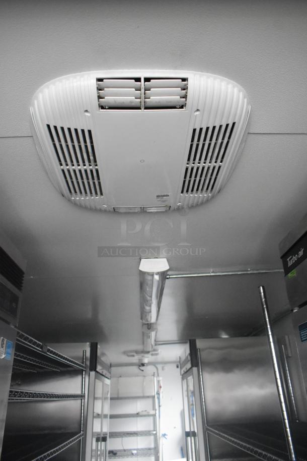Interior of a Southern Dimensions 24' cold food trailer with Turbo Air coolers, wire shelving, and overhead lighting.