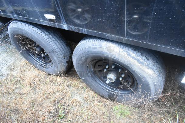 Southern Dimensions 24' food trailer tires and black exterior. Well-maintained, suitable for cold food and beverage retail.