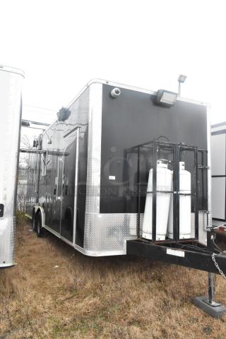 ATX 24' unbranded food trailer, black exterior with utility hook-ups, 2021 model, equipped for mobile kitchen use.