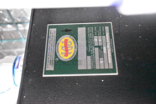 Green label on Ashland grease trap, model 480A, showing certification and specifications.