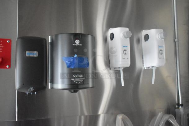 Georgia-Pacific SofPull paper dispenser and Ecolab soap dispensers mounted on stainless steel wall in ATX food trailer.
