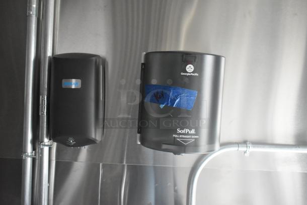 Georgia-Pacific SofPull dispenser and Kolar unit in stainless steel food trailer interior. New condition, unbranded setup.