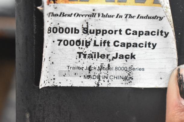 Label on the ATX food trailer shows "8000lb Support Capacity, 7000lb Lift Capacity, Trailer Jack Model 8000 Series, Made in China."