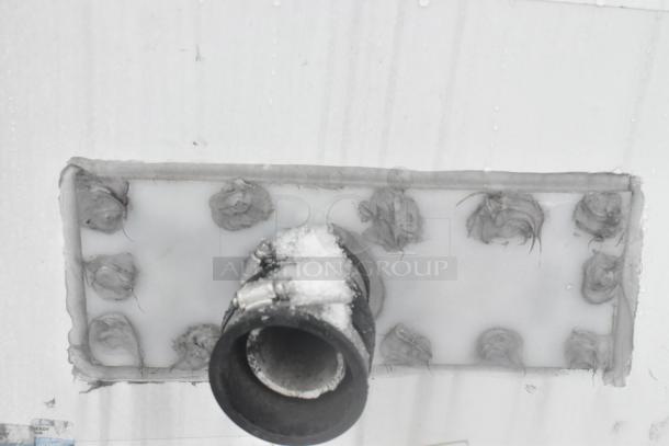 Roof of a Cruising Kitchens 24' food trailer, showing a black pipe with visible snow and sealed attachments.